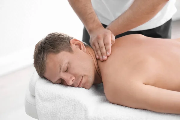 Relaxed Man Receiving Back Massage Wellness Center — Stock Photo, Image