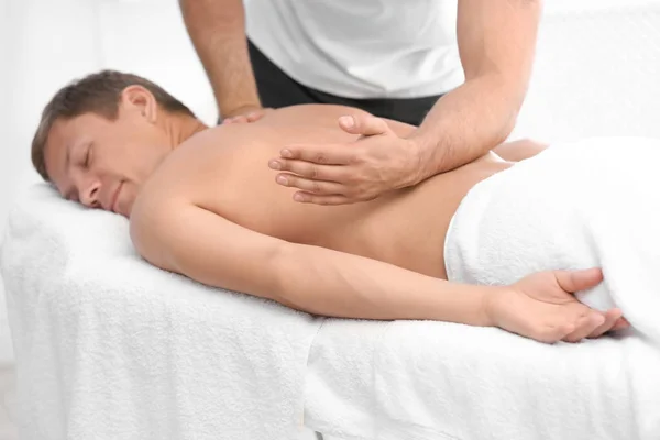 Relaxed Man Receiving Back Massage Wellness Center — Stock Photo, Image