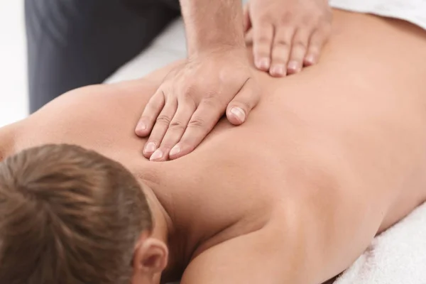 Relaxed Man Receiving Back Massage Wellness Center — Stock Photo, Image