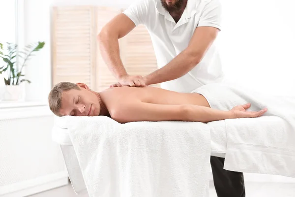 Relaxed Man Receiving Back Massage Wellness Center — Stock Photo, Image