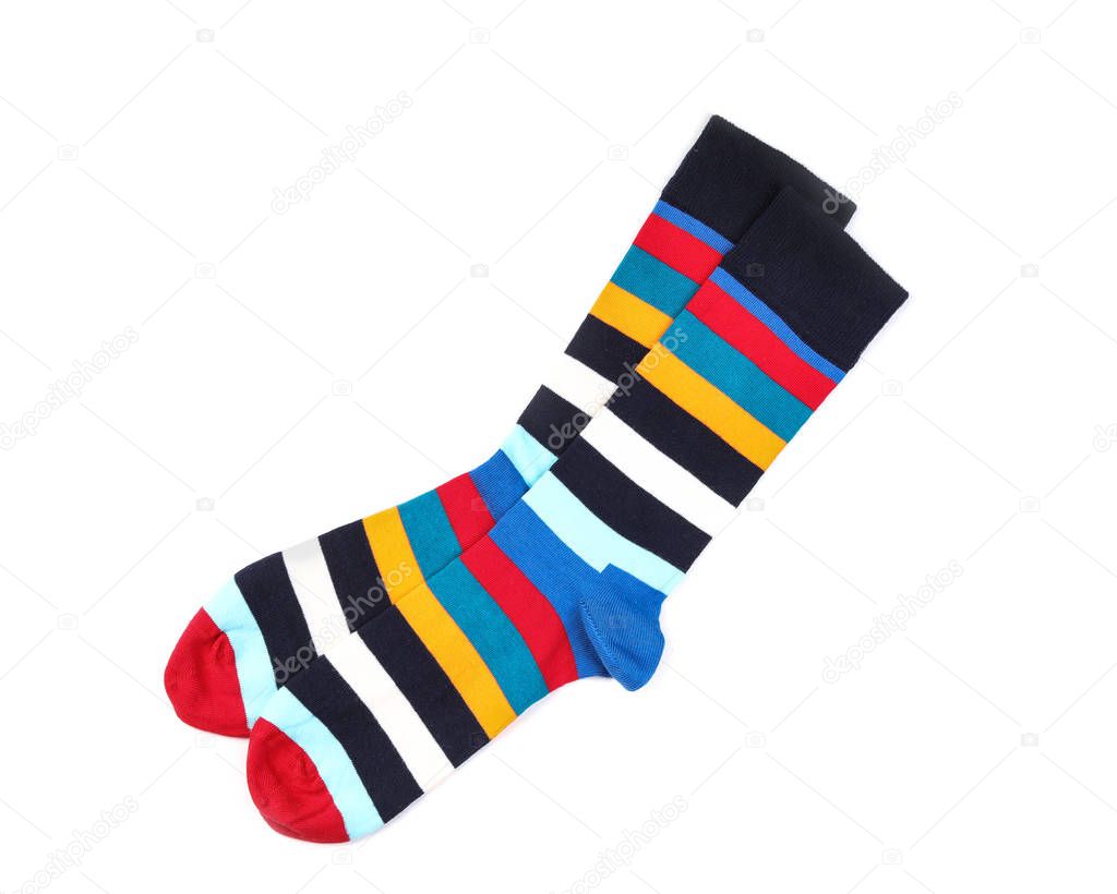 Colorful socks on white background, top view
