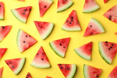 Flat lay composition with slices of watermelon on color background clipart