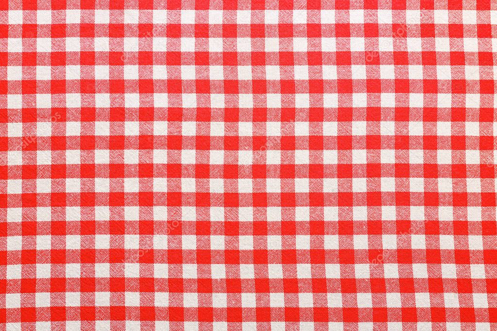Checkered picnic tablecloth as background, top view