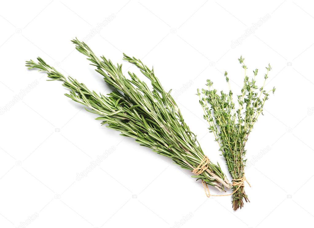 Rosemary and thyme on white background, top view. Aromatic herbs