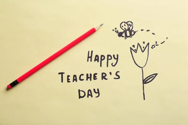 Pencil, text HAPPY TEACHER'S DAY and drawings on paper