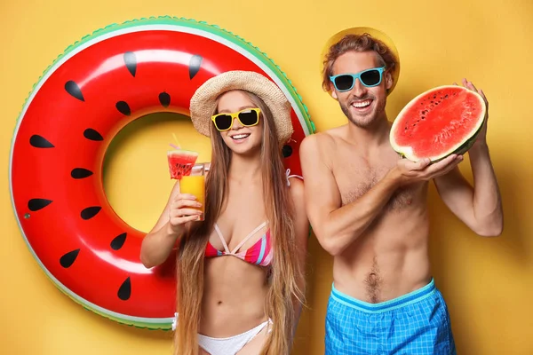 Young Couple Beachwear Inflatable Ring Watermelon Color Background — Stock Photo, Image