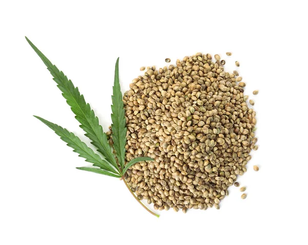 Pile Hemp Seeds Green Leaf White Background Top View — Stock Photo, Image
