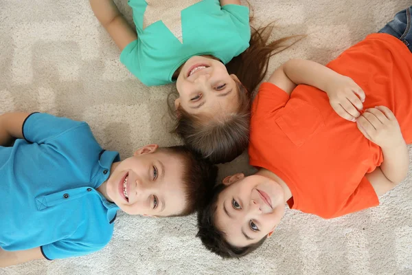 Cute Little Children Lying Together Floor Playing Room Top View — Stock Photo, Image