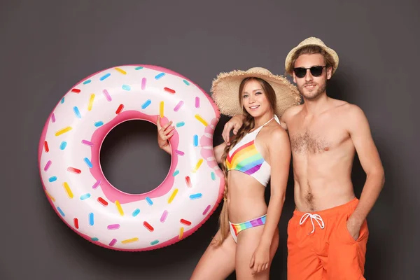 Young Couple Beachwear Inflatable Ring Dark Background — Stock Photo, Image