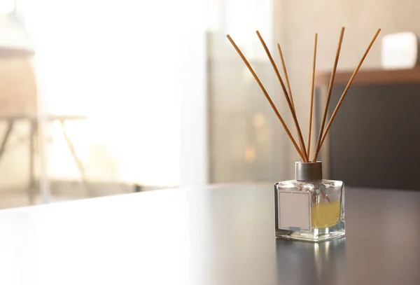 Reed air freshener on table in room