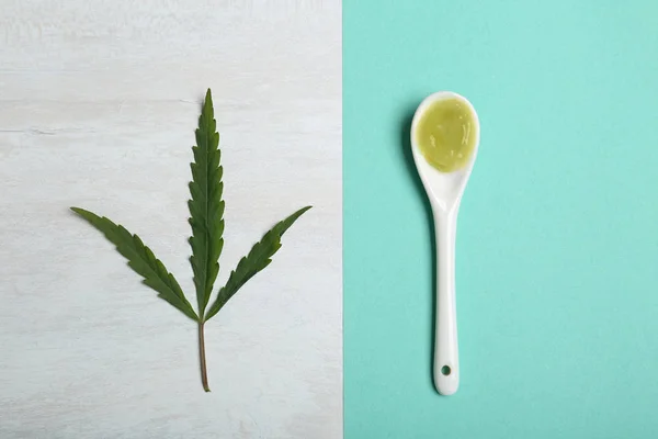 Flat lay composition with hemp lotion on color background