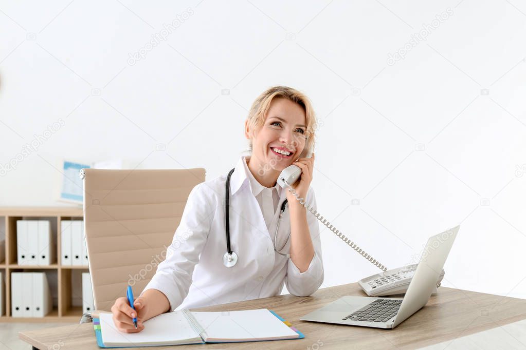 Female medical assistant at workplace in clinic. Health care service