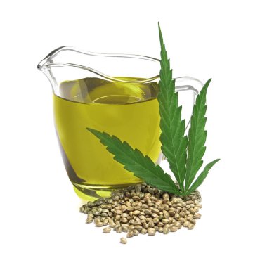 Kenevir yağı, yaprak ve tohum beyaz arka plan üzerinde ile sürahi