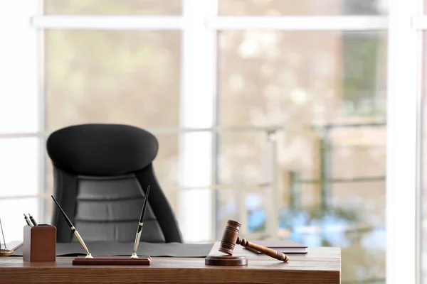 Table with judge gavel in lawyer\'s office