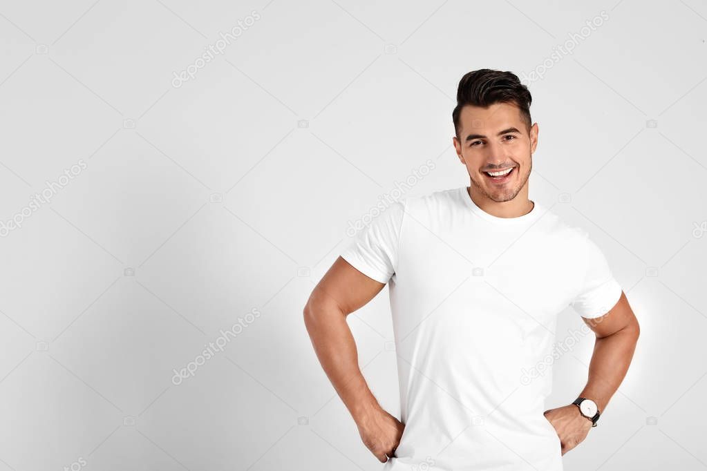 Portrait of handsome young man and space for text on white background