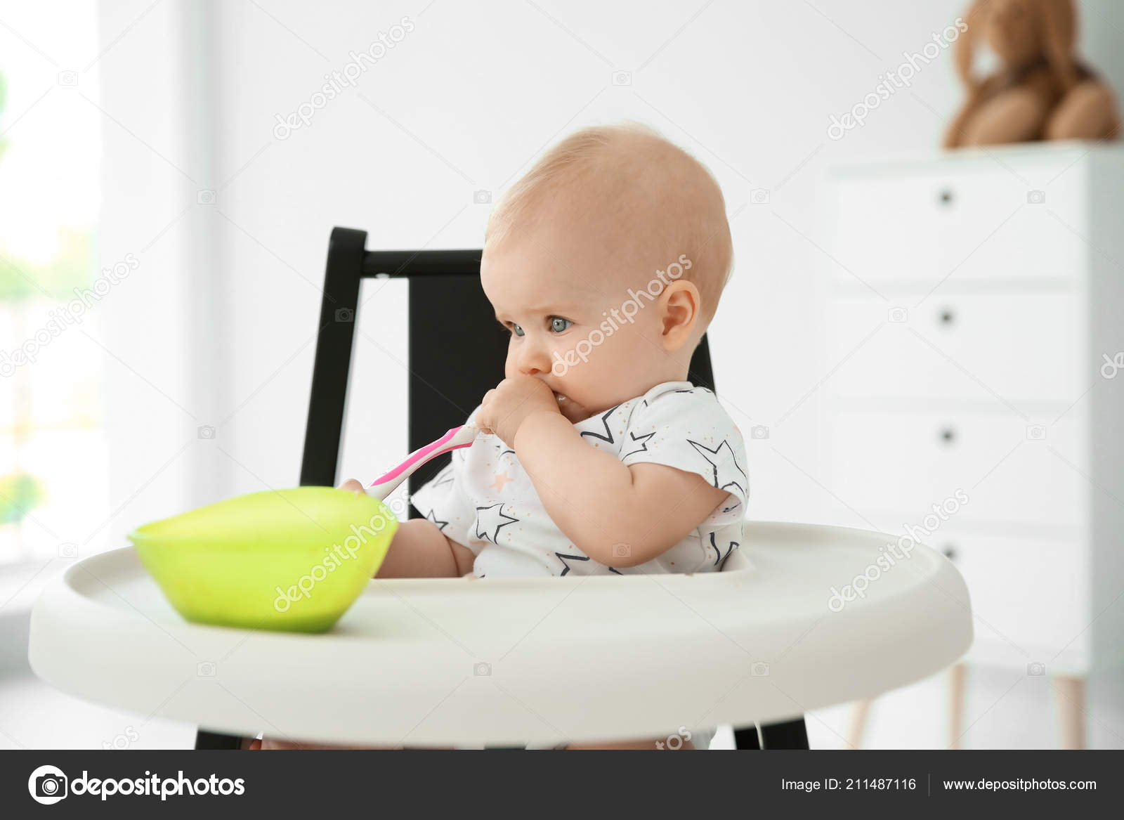 baby eating in high chair