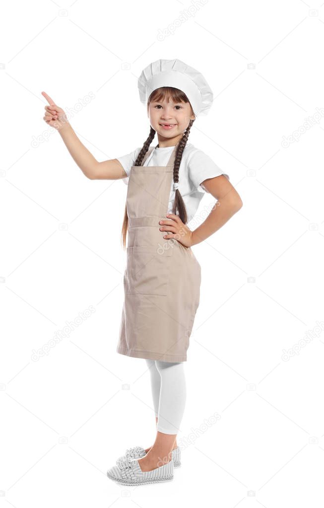Full length portrait of little girl in chef hat on white background