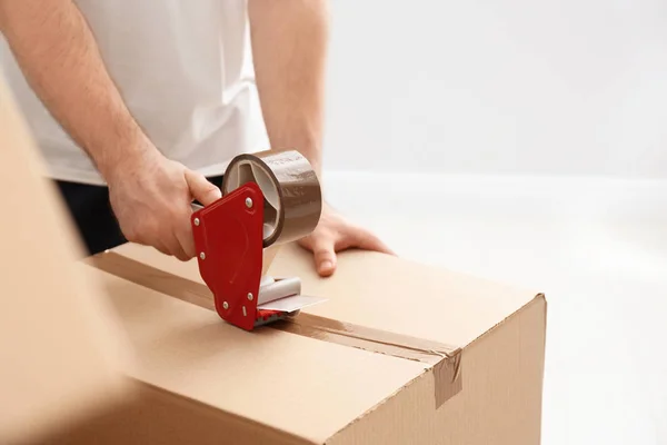 Man Packing Carton Box Indoors Closeup Moving Day — Stock Photo, Image