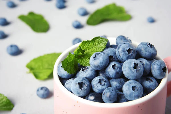 Cup Juicy Blueberries Green Leaves Color Table Stock Picture