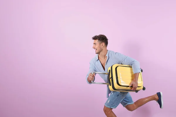 Young Man Running Suitcase Color Background Space Text — Stock Photo, Image