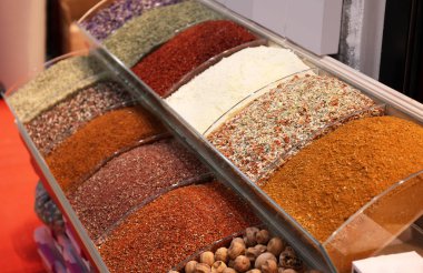 Assortment of colorful aromatic spices at market clipart