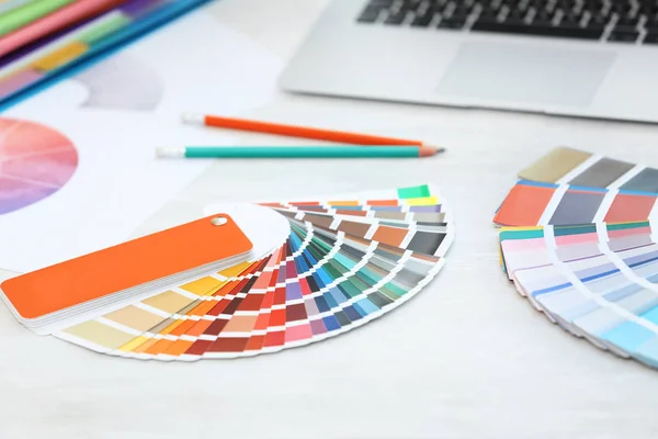 Paint color palette samples on table, closeup