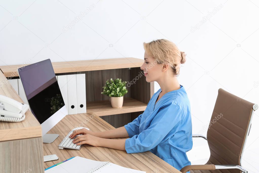 Female medical assistant at workplace in clinic. Health care service