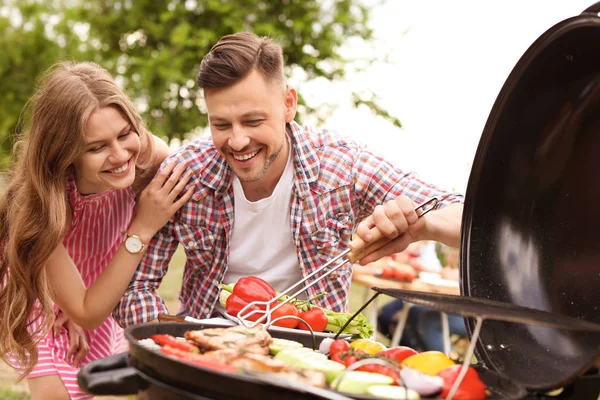 Young Couple Having Barbecue Modern Grill Outdoors — Stock Photo, Image