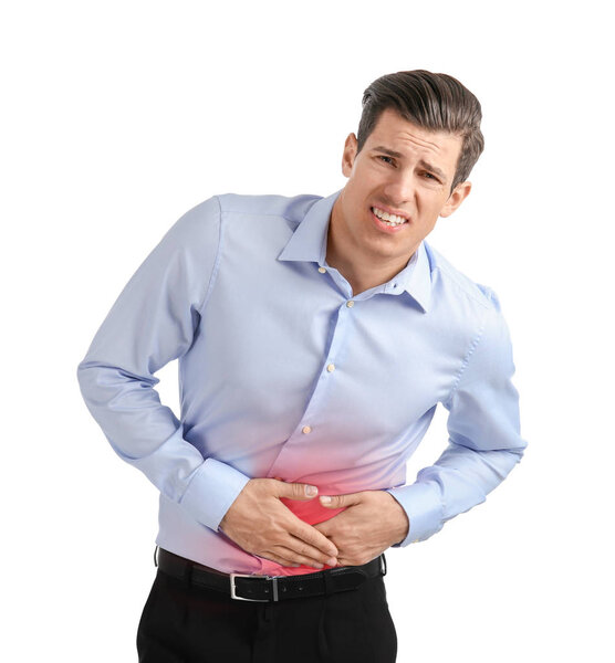 Young man suffering from abdominal pain on white background