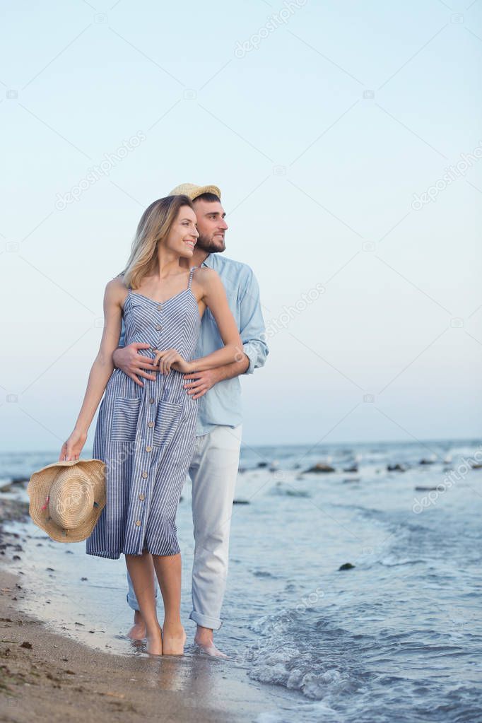 Young couple spending time together on beach