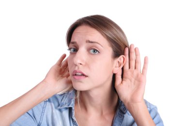 Young woman with hearing problem on white background clipart