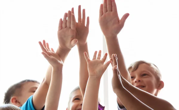 Little Children Raising Hands Together Indoors Unity Concept — 스톡 사진