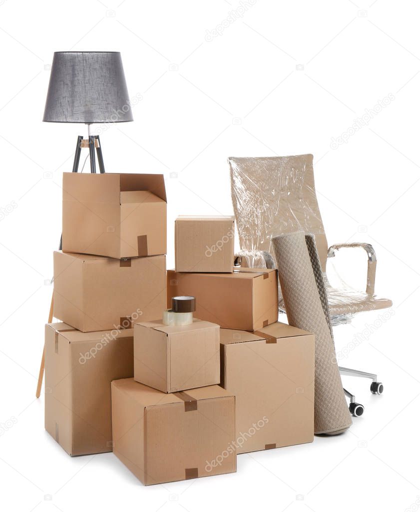 Cardboard boxes and household stuff on white background. Moving day