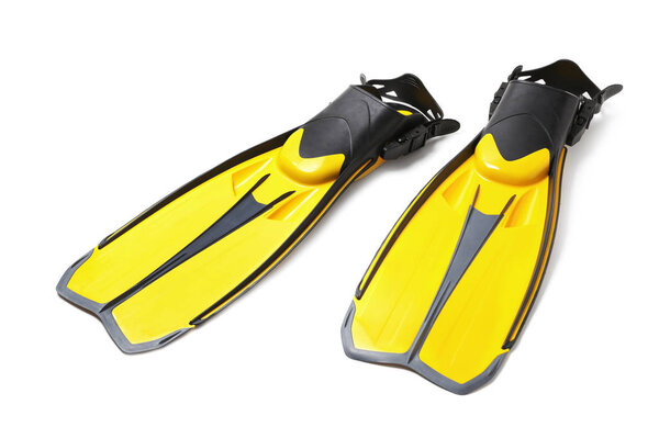Pair of yellow flippers on white background