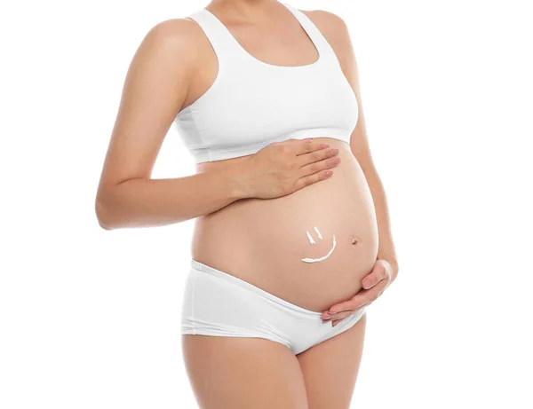 Úsměv Namaloval Tělem Krém Břicho Těhotné Ženy Proti Bílému Pozadí — Stock fotografie