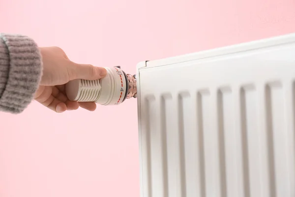 Woman Adjusting Heating Radiator Color Background — Stock Photo, Image