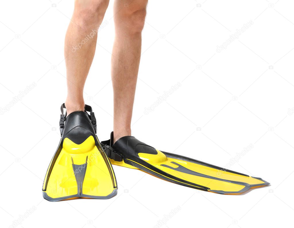 Man wearing yellow flippers on white background, closeup