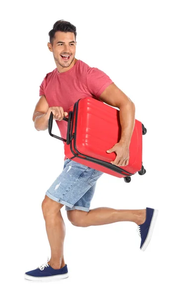 ホワイト バック グラウンドでスーツケースを持って走っている若い人 — ストック写真