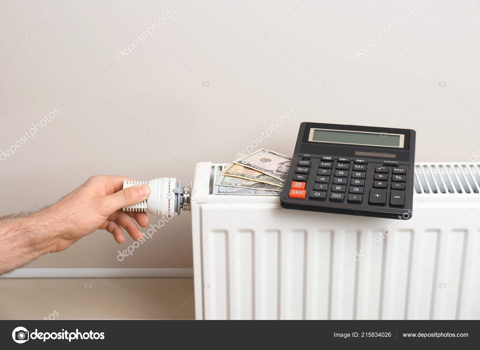 Man Adjusting Temperature Heating Radiator Calculator Money Indoors