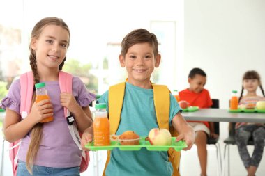 Children with healthy food at school canteen clipart