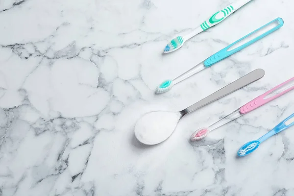 Flat Lay Composition Spoon Baking Soda Toothbrushes Space Text Marble — Stock Photo, Image