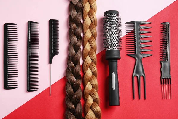 Flat lay composition with hair salon tools on color background