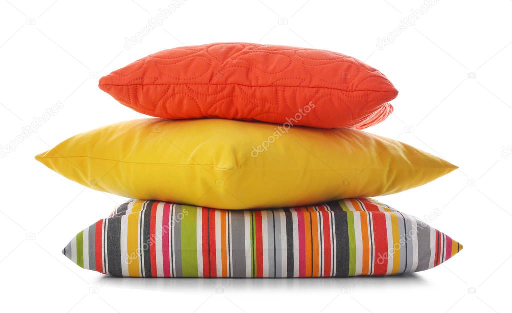 Stack of different colorful pillows on white background