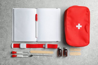 Flat lay composition with medical items on gray background clipart