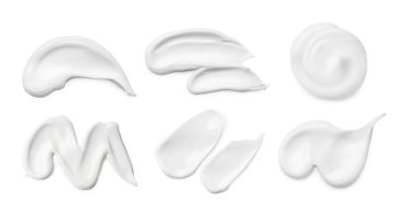 Set with different cosmetic smears on white background clipart