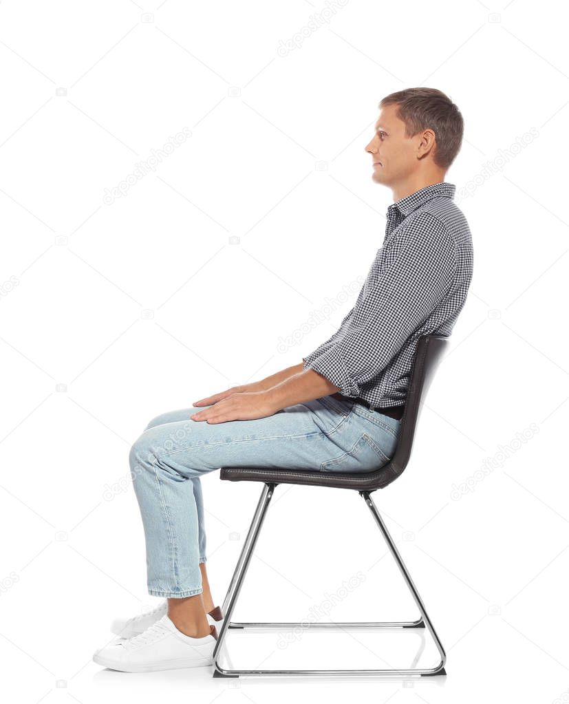 Man with good posture sitting on chair against white background