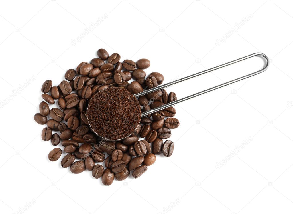 Scoop with coffee grounds and roasted beans on white background, top view