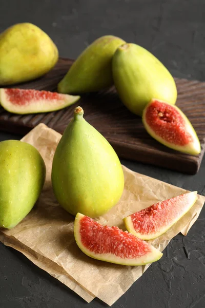 Fresh ripe figs on dark background. Tropical fruit