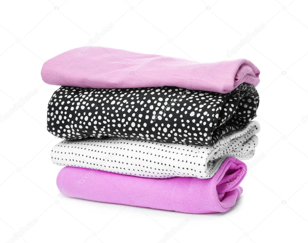 Stack of colorful children's clothes on white background