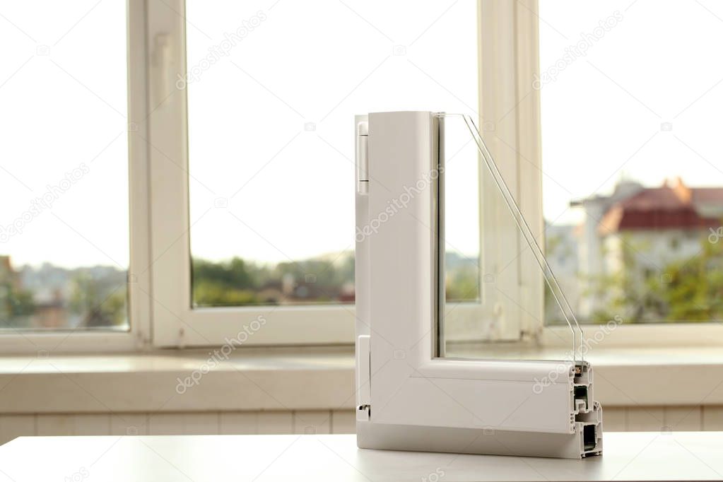 Sample of modern window profile on table indoors